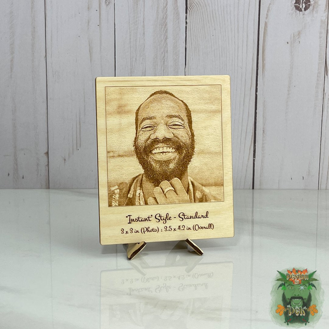 Wooden plaque with laser-engraved portrait on a stand against a wooden background