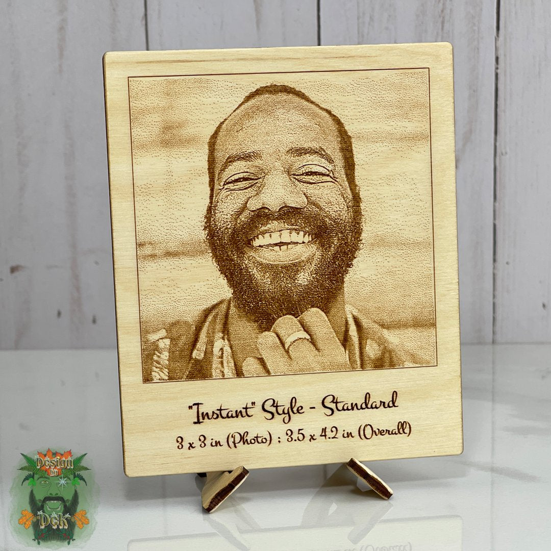 Wooden plaque with engraved photo of a smiling man and text on a wooden stand.