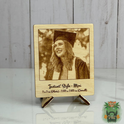 Wooden photo frame with a laser-cut portrait of a person in graduation attire on a wooden stand.